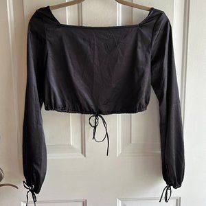 Free People going out top with bow tie waist and bow tie wrist detailing